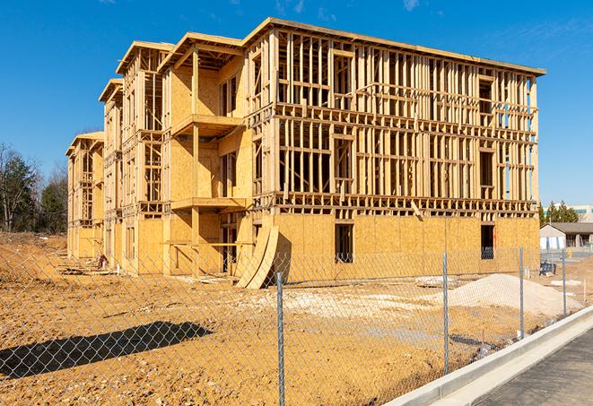 a temporary chain link fence in front of a building under construction, ensuring public safety in Monterey Park CA